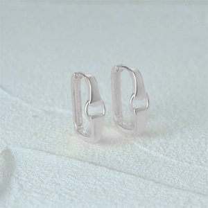 Detailed close-up of S925 sterling silver rectangular hoop earrings with bit design