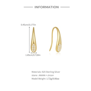 Macro detail of teardrop S925 silver earrings with AAAAA cubic zirconia inlay and gold plating