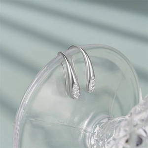 Macro shot of S925 sterling silver drop earrings with pavé set cubic zirconia