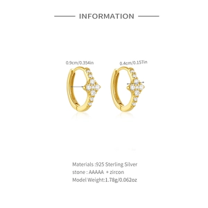 Detail of 925 sterling silver gold hoop earrings with pavé set zircon diamond pattern