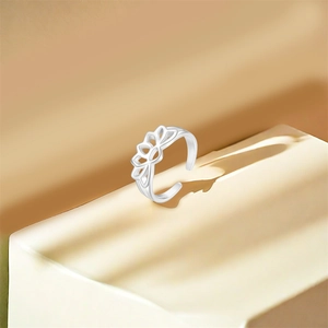 Detail of S925 sterling silver stamp on the inner band of an open lotus flower ring