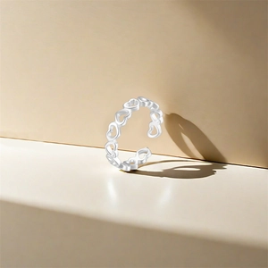 Detail of hollow heart-shaped S925 sterling silver open ring with hallmark stamp