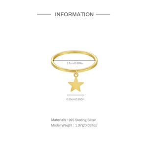 Macro detail of S925 sterling silver gold ring with star charm and size specifications