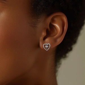 Close-up of S925 silver heart stud earrings with colorful stones and Love engraving