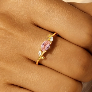 Detailed close-up of S925 silver leaf ring featuring pink oval zircon on a model hand