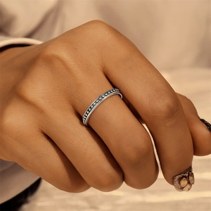 Macro shot of S925 sterling silver beaded ring on model finger showing fine details