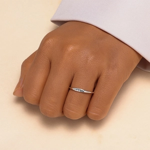 Macro view of a 925 sterling silver ring featuring engraved moon phase cycle patterns
