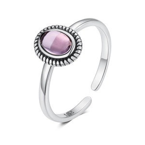 Macro shot of S925 silver stamp on retro ring band with oval purple gemstone detail