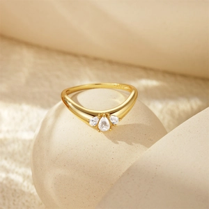 Detailed macro view of S925 sterling silver stamp and teardrop zircon crown ring