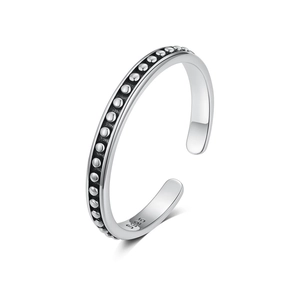 Macro detail of S925 sterling silver ring featuring vintage metal beadwork and oxidation