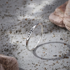 Detail of S925 sterling silver ring showing minimalist moon phase engraving on stone
