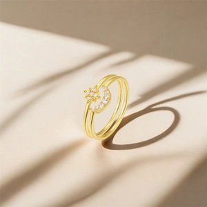 Macro detail of S925 sterling silver gold ring with star and moon zircon elements