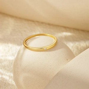 Detailed view of elegant gold s925 silver ring featuring a sparkling diamond accent