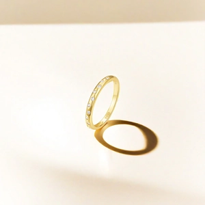 Macro shot of S925 hallmark on a thin gold-plated silver ring with micro zircons
