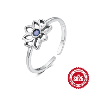 Elegant S925 sterling silver open ring with hollow flower design and blue opal center