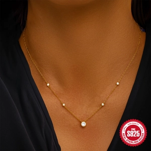 Classic S925 sterling silver gold-plated necklace with round zircon pendant on model
