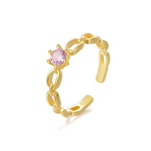 Detail shot of a S925 sterling silver gold-plated ring with a pink zircon in 6-prong setting