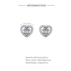 Gros plan sur boucles d'oreilles patte en argent S925 avec pierre de lune et zircon