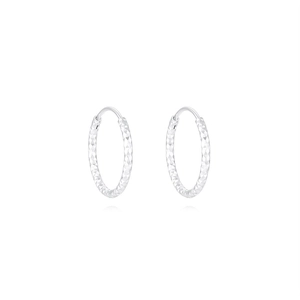 Macro detail of diamond-cut texture on S925 sterling silver hoop earrings in silver finish