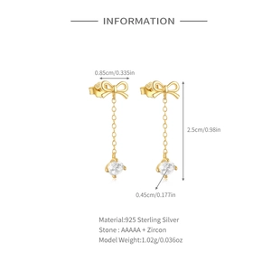 Detail view of S925 silver bow earrings with long tassels and white zircon stones