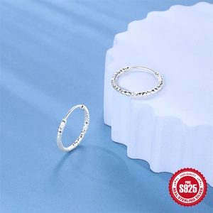 Polished S925 sterling silver hoop earrings with diamond-cut geometric texture