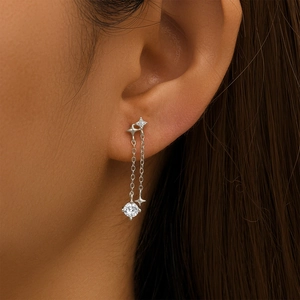 Detail of S925 silver tassel earrings featuring four-pointed stars and zircon stones