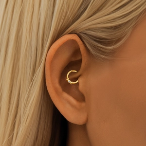 Detail of S925 sterling silver ear cuff featuring a centered zircon and moon design