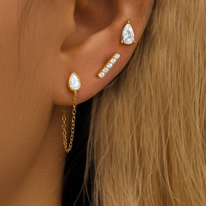 Detailed view of S925 silver gold-plated ear sets with water drop and bar zircon studs