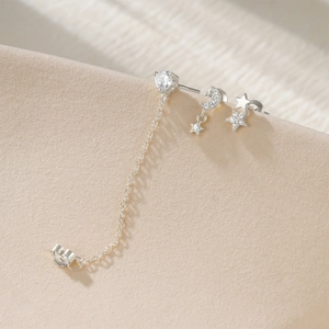 Detailed view of S925 silver star and moon earring set with cubic zirconia stones