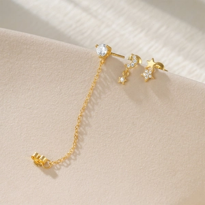 Macro shot of S925 sterling silver star and moon earrings set with sparkling cubic zirconia