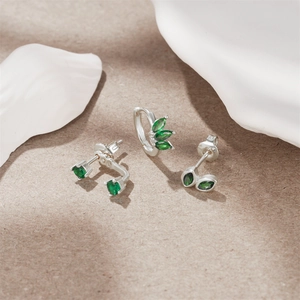Detailed set of S925 silver earrings featuring vibrant green gemstones and cubic zirconia