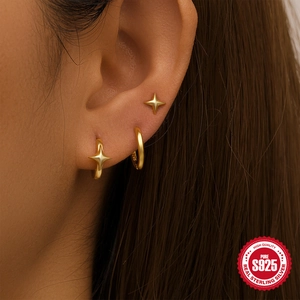 Minimalist gold S925 sterling silver star earring set with turquoise on a female model