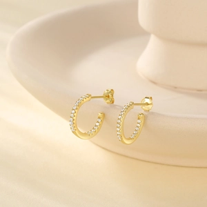 Detailed view of S925 sterling silver gold C-shaped earrings with micro-set zircons