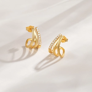 Detail of gold C-shape wave earrings featuring three-layer design with micro pave zircon