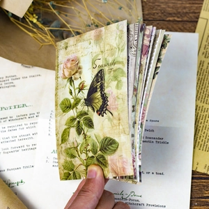 Close-up of vintage butterfly and rose patterned scrapbooking paper with a retro aesthetic