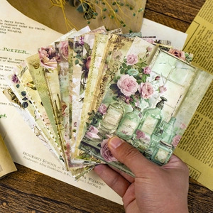 Close-up of vintage DIY scrapbooking paper with floral and Paris tower designs