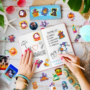 Cute Halloween sticker set featuring pumpkins and ghosts on a notebook cover detail