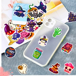 Halloween stickers on a phone case featuring cartoon pumpkin and ghost motifs