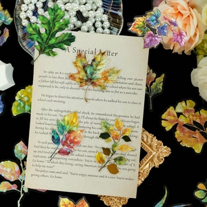 Detalle de pegatinas de hojas de PET holográfico con bordes dorados para scrapbooking vintage