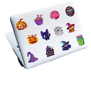 Waterproof Halloween sticker pack featuring pumpkins and cats on a laptop surface