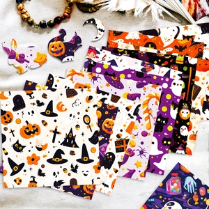 Detail of Halloween scrapbooking paper kit with cute ghost and pumpkin motifs