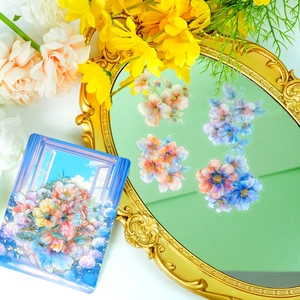 Detail of multi-color floral PET stickers with gold foil displayed on an elegant mirror