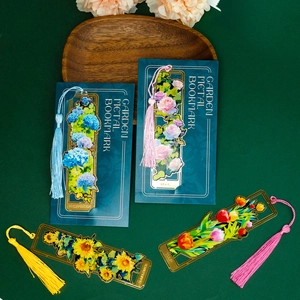 Hollowed-out floral brass bookmarks with tassels featuring sunflower and rose designs