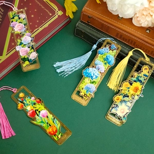 Exquisite hollow brass bookmarks with floral designs and colorful silk tassels