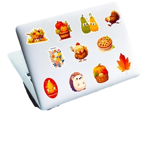 Waterproof Thanksgiving stickers set with cute turkey and pumpkin designs on a laptop