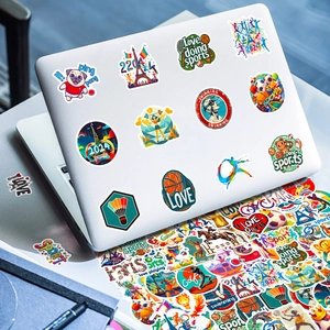 Detail of 2024 Paris sports stickers on a laptop including tennis and swimming icons