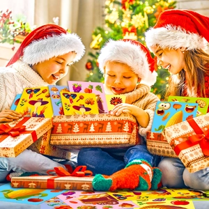 Close-up of children opening Thanksgiving puzzle stickers box with turkey and pumpkin motifs