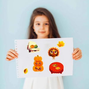Detail showing Thanksgiving stickers with turkey and pumpkin patterns on a display board
