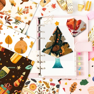 Close-up of Thanksgiving pumpkin and turkey scrapbooking paper with autumn decorative leaves