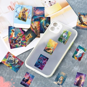 Holographic animal stickers applied on a phone case with vibrant pop art galaxy patterns
